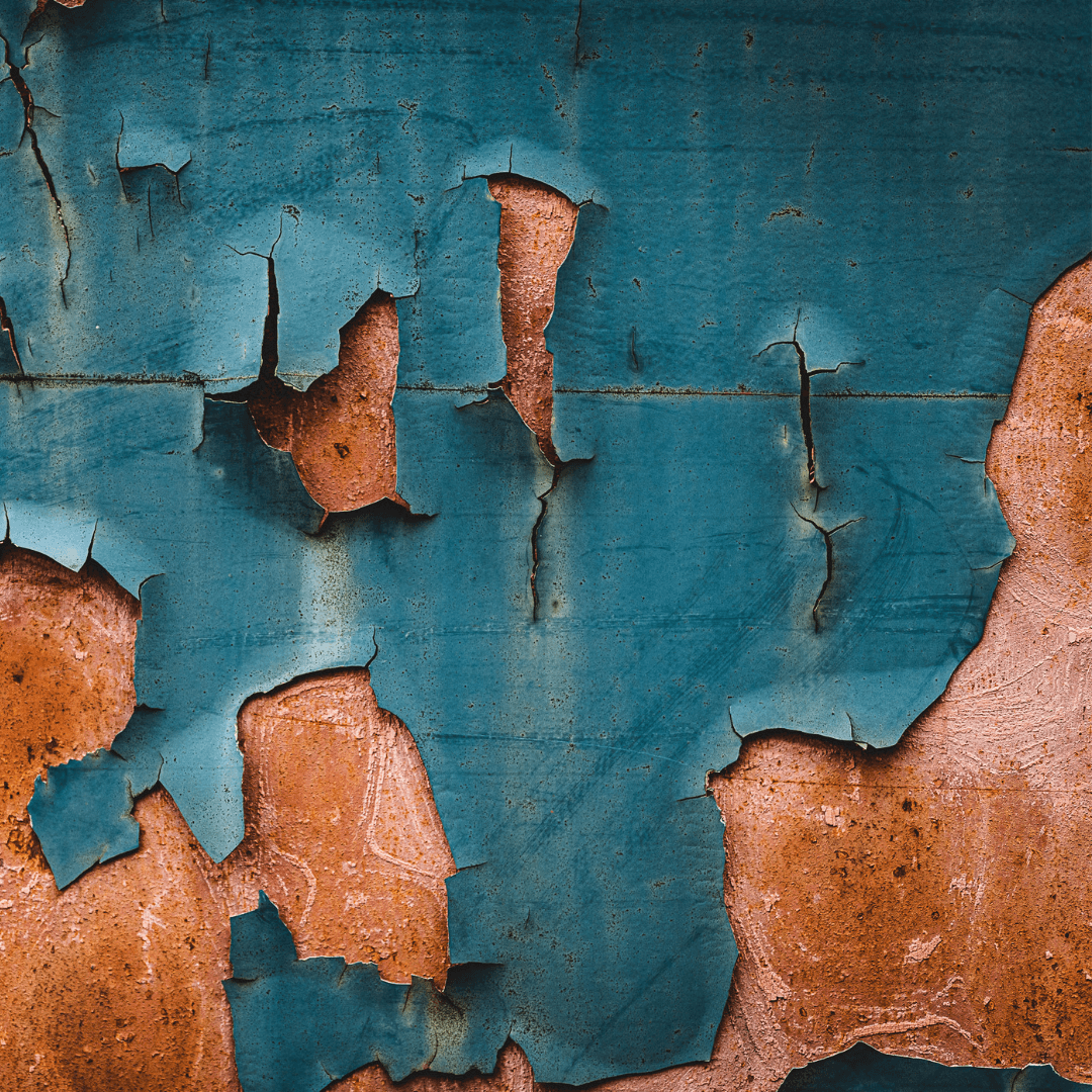 peeling paint from a dirty surface