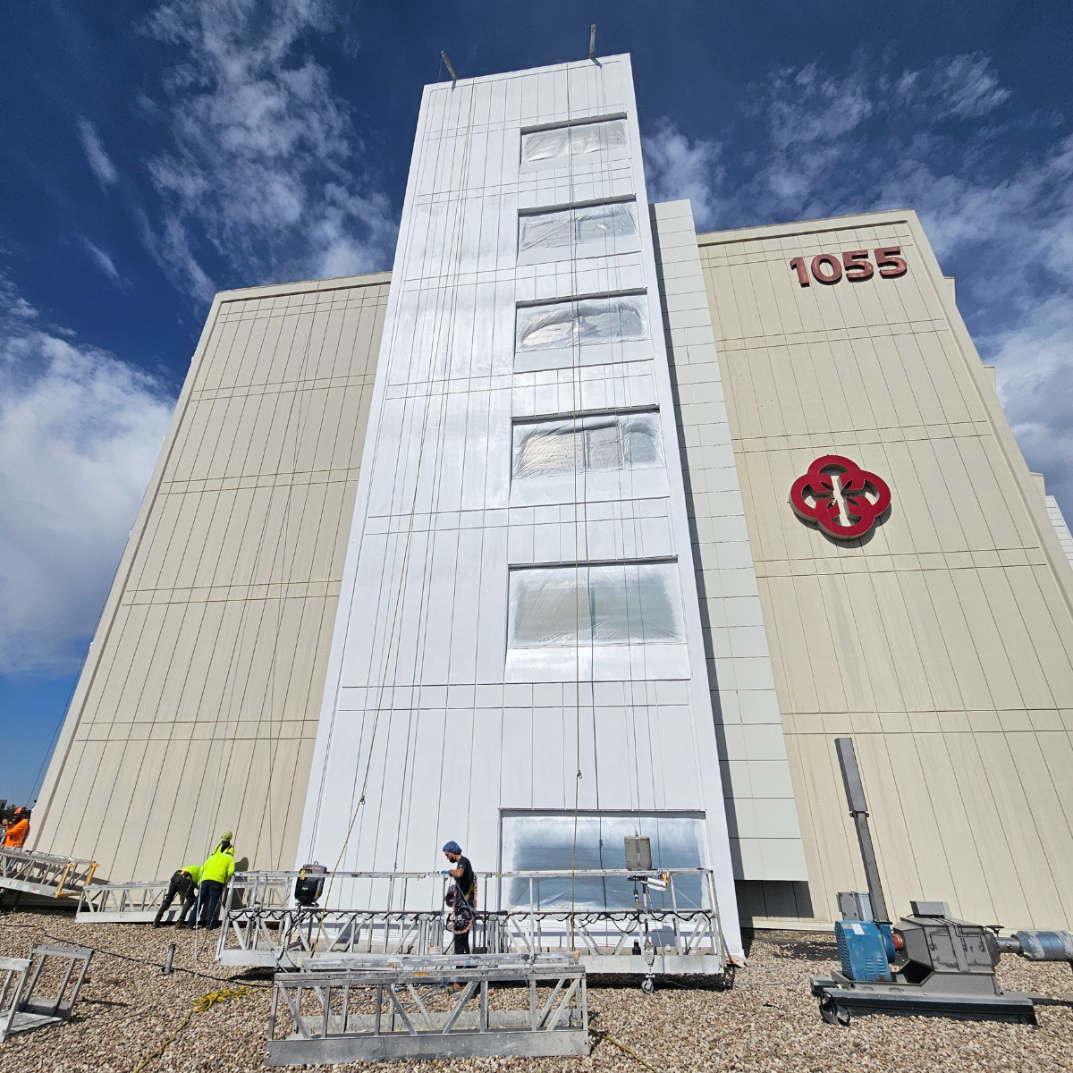 hospital exterior painting with a swing stage in boise