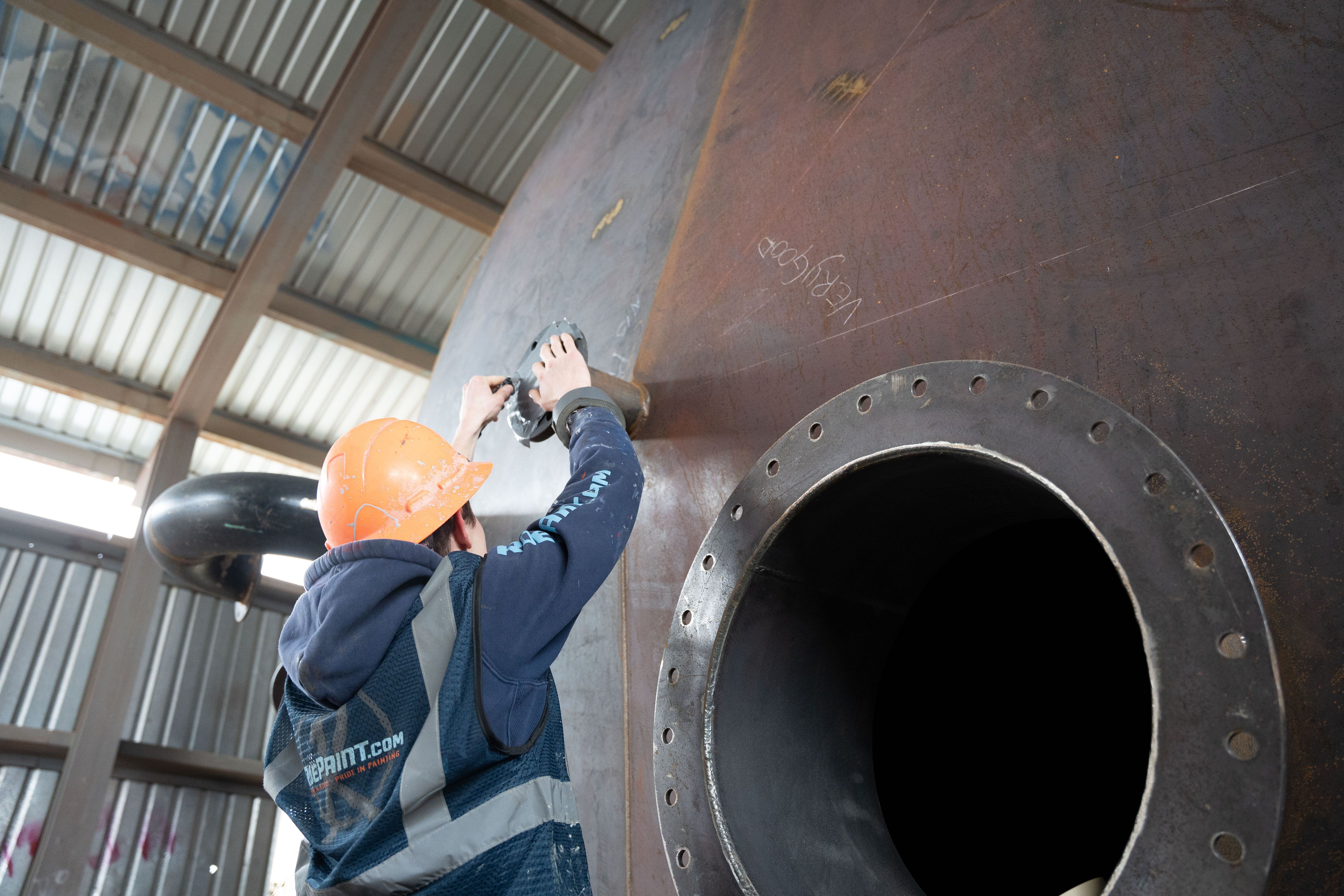 prep and inspection of a steel tank before industrial coating services are provided