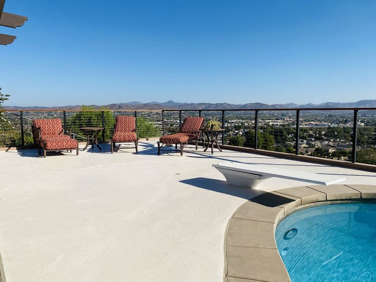 pool deck with diving board and multi color