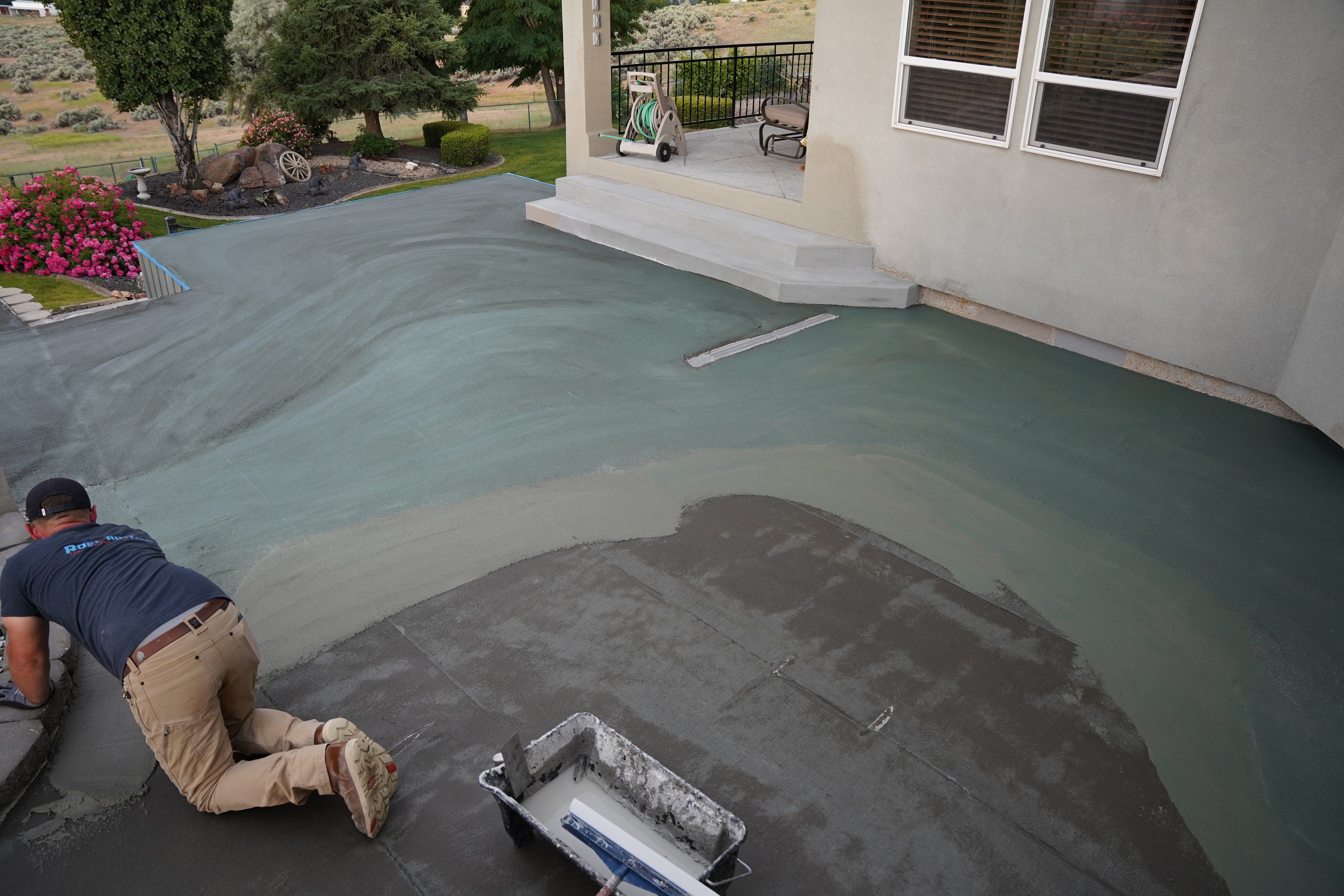 trowled applied concrete floor coating on a back deck patio