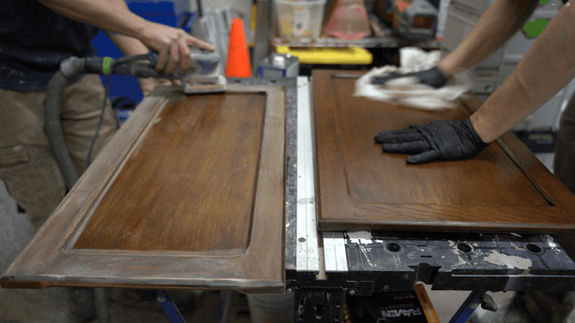 cabinet doors being prepped for repainting by sanding and priming