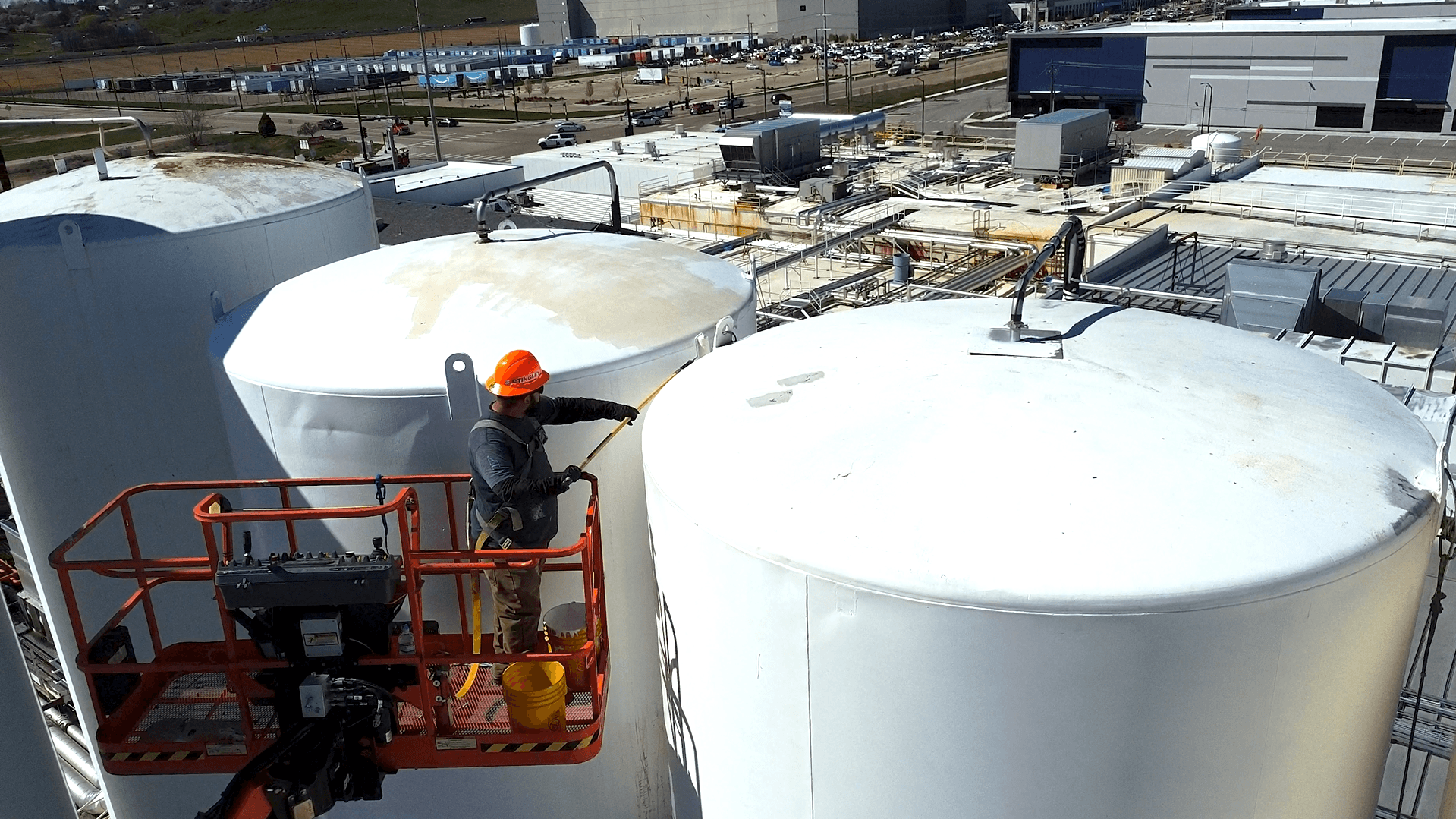 RoePaint.com painting industrial tank 70 ft in the air