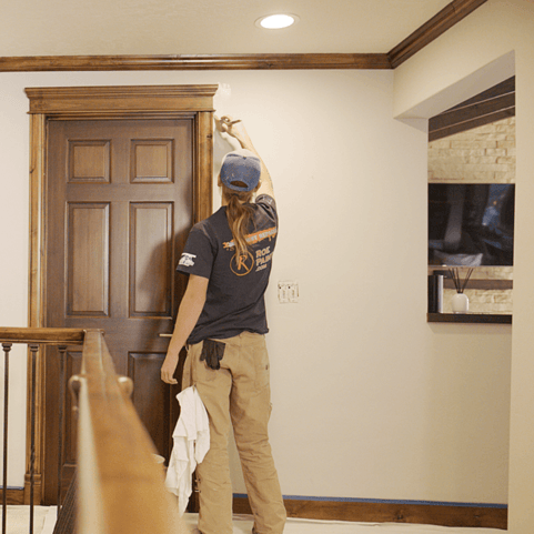 painter painting a house interior
